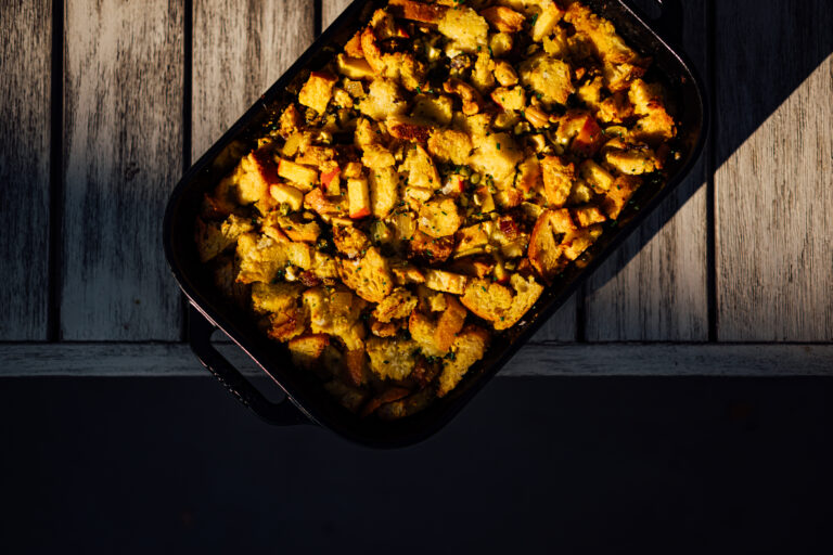 Indian-Spiced Stuffing with cashews, dates, and apples. A golden, fragrant bread stuffing made with ghee, cumin, coriander, and turmeric — perfect for Thanksgiving or holiday gatherings.